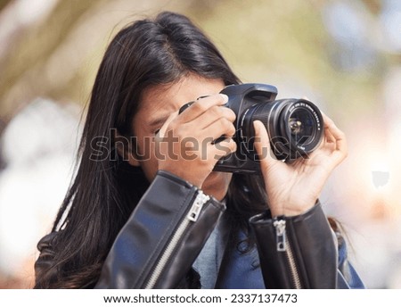Nature, photography and woman in park with camera, trees, art and creative influencer with inspiration focus in media. Girl, photographer or content creator in garden taking picture for social media.