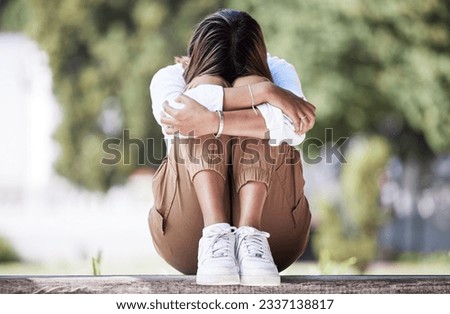 Sad, depression and student with woman in park for cry, frustrated and stress. Mental health, anxiety and fear with female person in nature for psychology, tired and fatigue with mockup space Royalty-Free Stock Photo #2337138817