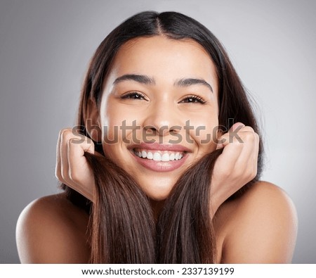 Portrait, beauty and woman with hair care, smile and luxury treatment against a grey studio background. Face, female person or happy model with grooming routine, happiness and clean scalp with volume