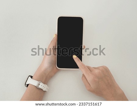 Mock-up Screen Smartphone, Smartphone in girl's hands, mobile phone with blank white screen