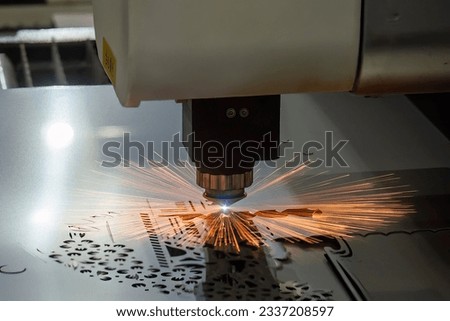 The fiber laser cutting machine cutting  machine cut the metal plate. The hi-technology sheet metal manufacturing process by laser cutting machine.  Royalty-Free Stock Photo #2337208597