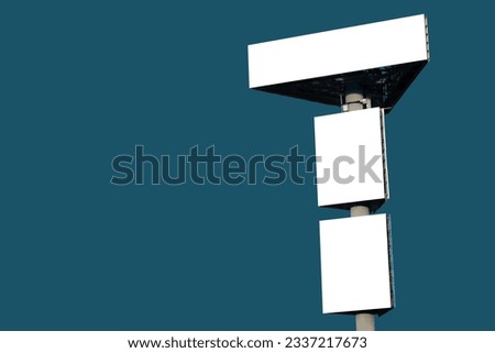 Mock up: three blank green billboards or large displays against blue-green background. Consumerism, white screen, isolated, template, mockup, copy space and advertising concept