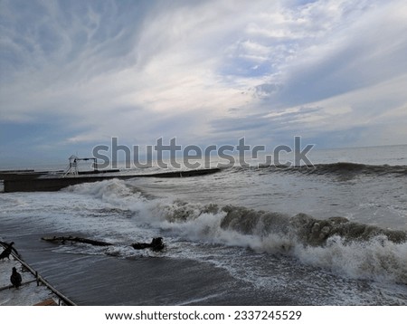 Black sea storm waves pier beach