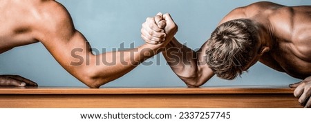 Two hands. Men measuring forces, arms. Hand wrestling, compete. Hands or arms of man. Arm wrestling. Two men arm wrestling. Rivalry, closeup of male arm wrestling.