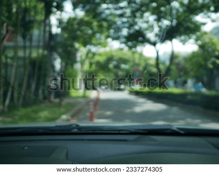 Blur focus of View inside the car with blurred road traffic conditions.