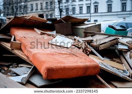 Construction waste. Broken furniture and household waste during the reconstruction of the apartment. Illegal dumping. Defocused. High quality photo Royalty-Free Stock Photo #2337298145