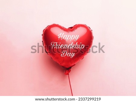 A red balloon with Happy Friendship Day written on it