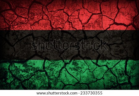 Pan-African  flag pattern on the crack soil texture ,retro vintage style Royalty-Free Stock Photo #233730355