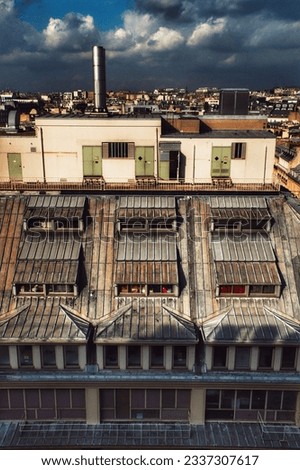 A breathtaking view of the iconic rooftops of Paris, showcasing the city's charm and architectural beauty.