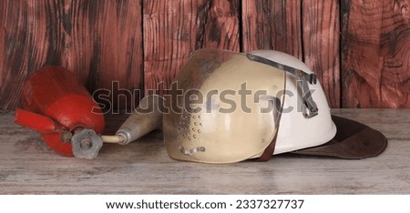 white firefighter helmet on wooden table