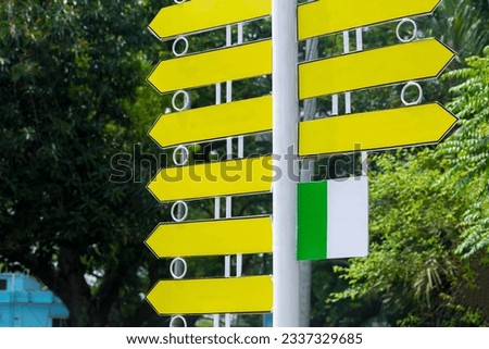 Roadside steel-making signposts are used to display instructions and information. Yellow color road route direction pointer. Roadside Instructional blank Sign.