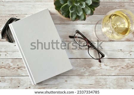Blank book cover for mock up with wine and glasses Royalty-Free Stock Photo #2337334785
