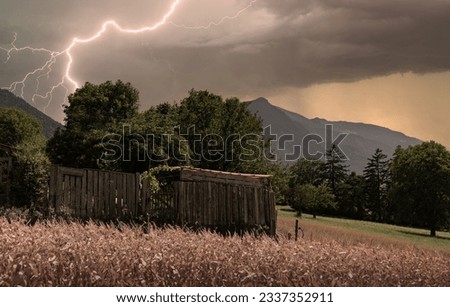 Thunderstorm mood with lightning over a garden in Chur, Switzerland