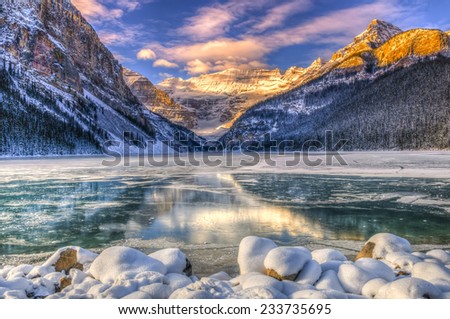 Winter sunrise over scenic Lake Louse in Banff National Park, Alberta Canada Royalty-Free Stock Photo #233735695