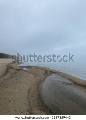 Foggy Beach with dreamy view of the lake. 