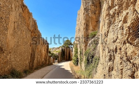 Rock cut passage on route of the old railway line Vía Verde del Mar (Greenway of the Sea) between Benicassim and Oropesa del Mar in Castellón Province, Valencian Community, Spain