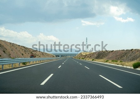 Empty toll highway. Otoyol 33 or North Aegean Motorway (Kuzey Ege Otoyolu) and abbreviated as the O-33 is a 55.2 km long toll motorway in western Turkey. Royalty-Free Stock Photo #2337366493