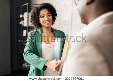 Employment Concept. Smiling Black Manager Woman Handshaking With Man Meeting For Job Interview Standing In Modern Office, Selective Focus. Business Partnership And Employee Recruitment Royalty-Free Stock Photo #2337369061