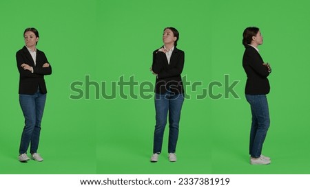 Impatient office worker waiting and being late, standing over full body green screen background. Young businesswoman wait, wearing suit on studio isolated greenscreen backdrop.