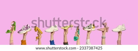 Multiple people's hands holding shoes of different colors and styles on isolated pink background with copy space. Creative advertising banner. Shoe summer sale, discount concept. Barbie pink style