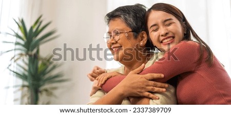 Portrait of enjoy happy love asian family senior mature mother and young daughter smiling play laughing and having fun together at home, care, elderly, insurance.happy family and Mother Day concept