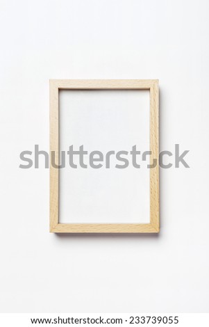 A white photo(picture) frame isolated white, top view at the studio. 