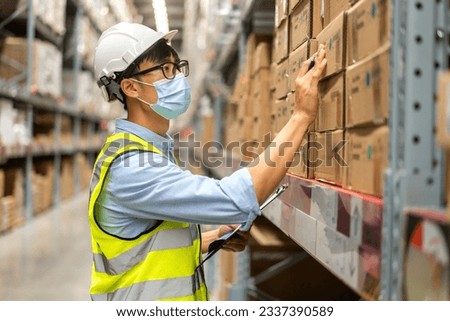 Portrait engineer worker labor asian man use tablet shipping order detail check goods and supplies on shelves with goods background inventory in factory warehouse.logistic industry and business export
