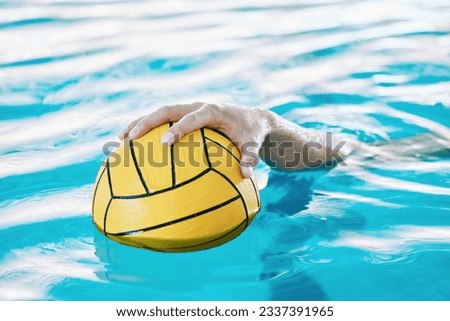 Ball, hand and water polo, swimming pool and sports with fitness, athlete and training for game. Person, swimmer and equipment with exercise, closeup and aquatic workout with challenge and match Royalty-Free Stock Photo #2337391965