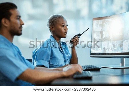 Security guard, safety and control room with a radio and computer monitor for surveillance. Man and woman working together for crime investigation, cctv screen and communication with a walkie talkie Royalty-Free Stock Photo #2337392435