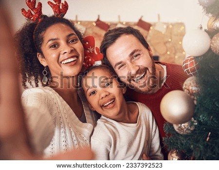 Christmas, happy family and portrait, selfie and funny together in home. Xmas, smile and face of parents with girl, interracial and African mom laughing with father for party, celebration and holiday