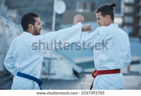 Men, fight and punch in karate class, training and speed with sparring partner, workout and morning for development. Martial arts team, contest and fitness with mma exercise, coaching or sports Royalty-Free Stock Photo #2337392705