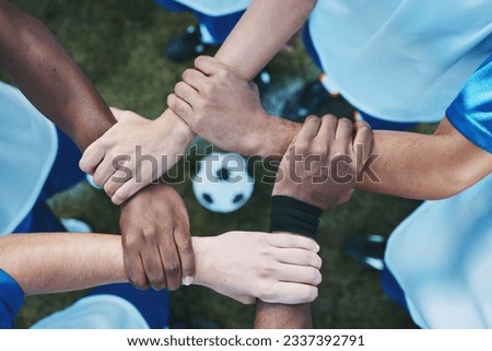Sports, teamwork and support with hands of soccer player on field for fitness, support and community. Goal, workout and mission with people training on football stadium for motivation and game