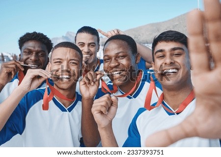 Men in selfie, medal and winner, soccer competition and sports, athlete group on field, diversity and success. Portrait, young male football player and team with smile in picture, winning and prize