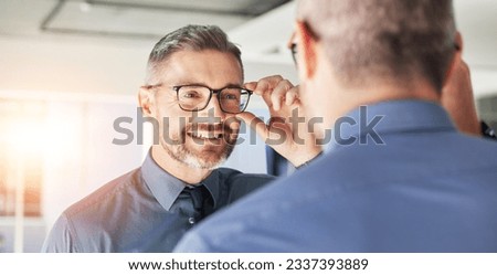 Glasses, choice and senior man, mirror and vision with eyewear in clinic, prescription lens with designer frame. Eyesight, eye care and optometry, healthcare and male person with spectacles decision Royalty-Free Stock Photo #2337393889