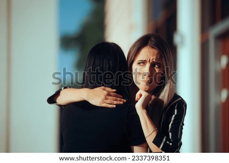 
Woman Hugging her Friend Having Mixed Feelings About Her
Girl uncomfortable with a stranger meeting and hugging her
 Royalty-Free Stock Photo #2337398351