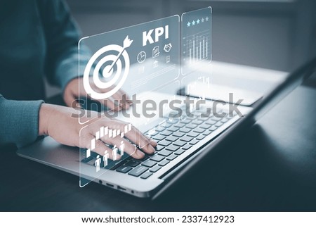 Key Performance Indicator (KPI)  Company Management Business Internet Technology Concept, Business people hand touch Key performance indicator business plan, Measure achievement versus planned target. Royalty-Free Stock Photo #2337412923