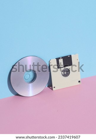 floppy disk and SD on pink blue background Royalty-Free Stock Photo #2337419607