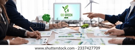 Go green ecology awareness campaign display on laptop on eco-friendly company meeting with business people implementing environmental protection for clean and sustainable future ecology. Trailblazing