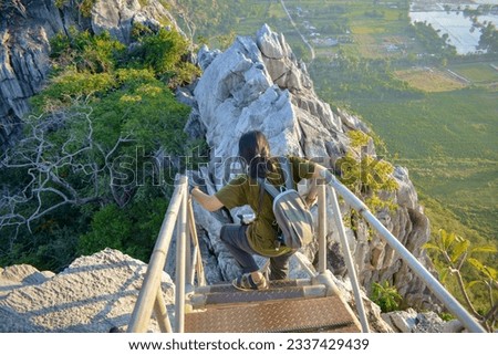woman climbing stairs climb the stairs up the hill mountain and tree background