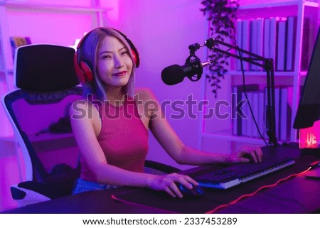 Young Asian woman pro gamer have online live streaming, Pretty girl singing and chatting with her fans at home, Excited woman wearing headset to live streaming broadcast games challenge social media