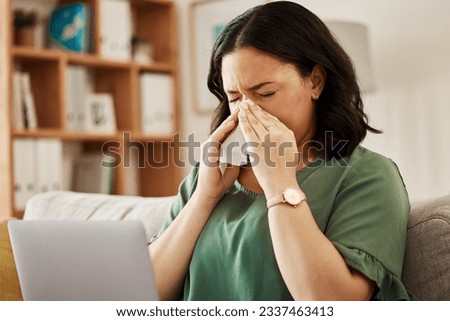 Remote work, laptop and sick woman on a sofa with flu, cold or viral infection in her house. Freelance, sneeze and lady online with allergies, virus or burnout, sinusitis or hayfever while working Royalty-Free Stock Photo #2337463413