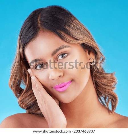 Face, woman and beauty, pink lipstick and makeup with skincare isolated on blue background. Portrait, wellness and cosmetic product for lips, cosmetology and female model with skin glow in studio