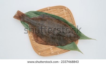 Fresh flounder on a bamboo basket.