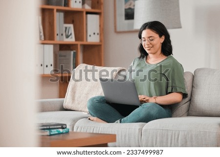 Happy woman, remote work and laptop on sofa in home for digital planning, online research or blog info. Female freelancer working on computer, technology and website media for telework in living room