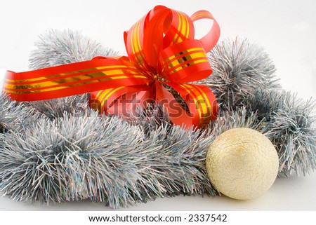 silver christmas decoration with red ribbon