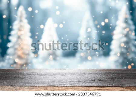 Empty wooden table for present product on christmas tree and bokeh blur background. Ready for product montage.Merry Christmas and Happy New Year Mockup