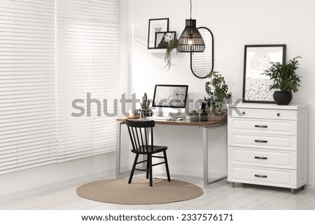 Cozy workspace with computer on wooden desk at home
