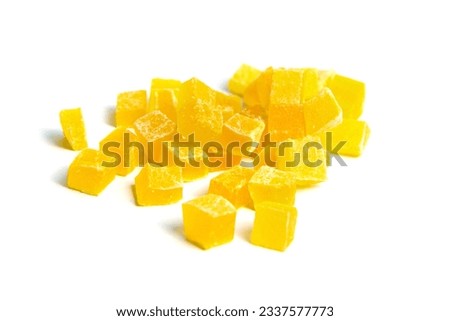 Diced mango dried fruits isolated on white background. Dehydrated mango chips dices closeup