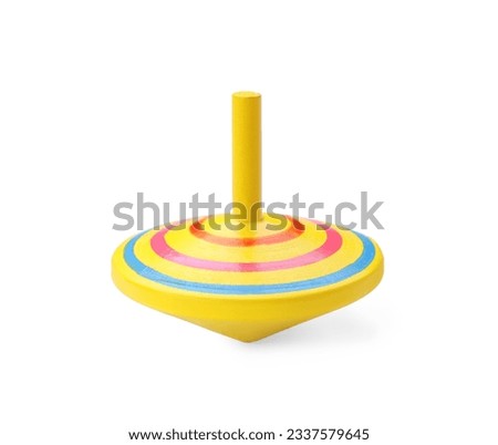 One bright spinning top isolated on white. Toy whirligig