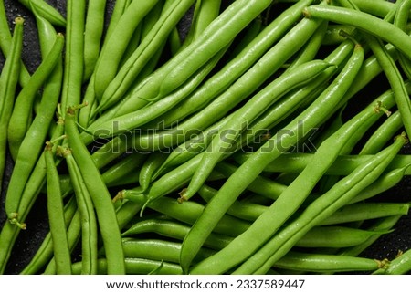 Heap of green pods of raw, not cooked, asparagus beans top view. Royalty-Free Stock Photo #2337589447